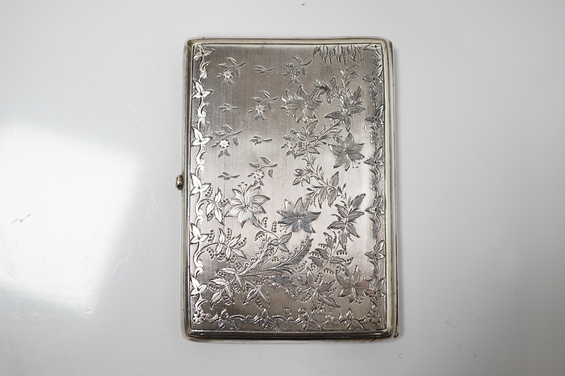 A Victorian engraved silver card purse with pencil and leather interior, Deakin & Francis, Birmingham, 1897, 10.5cm. Condition - good